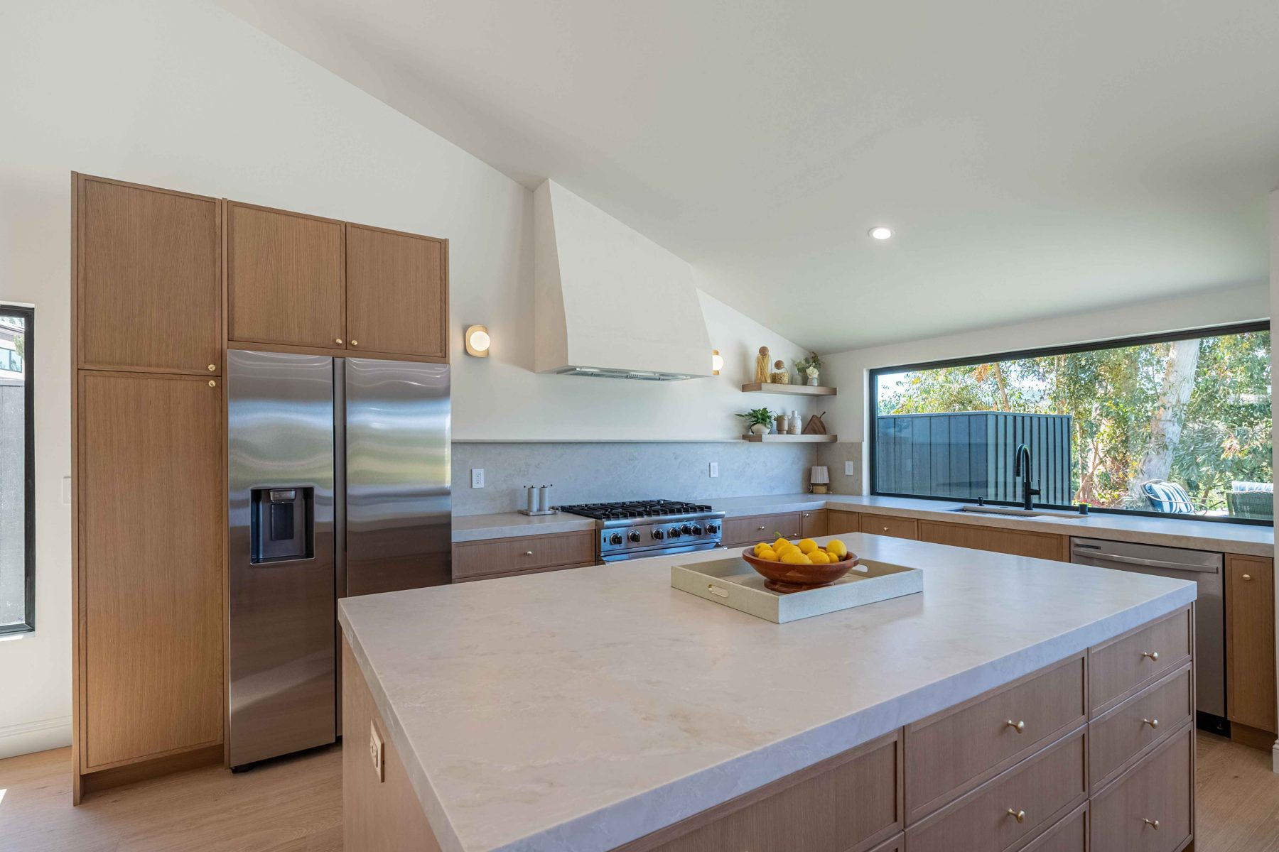 White-oak kitchen with picture window over range